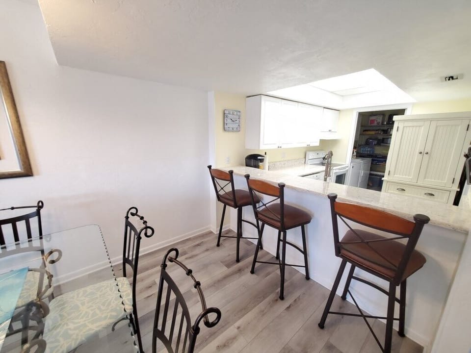 Open-plan kitchen with bar seating and modern amenities.