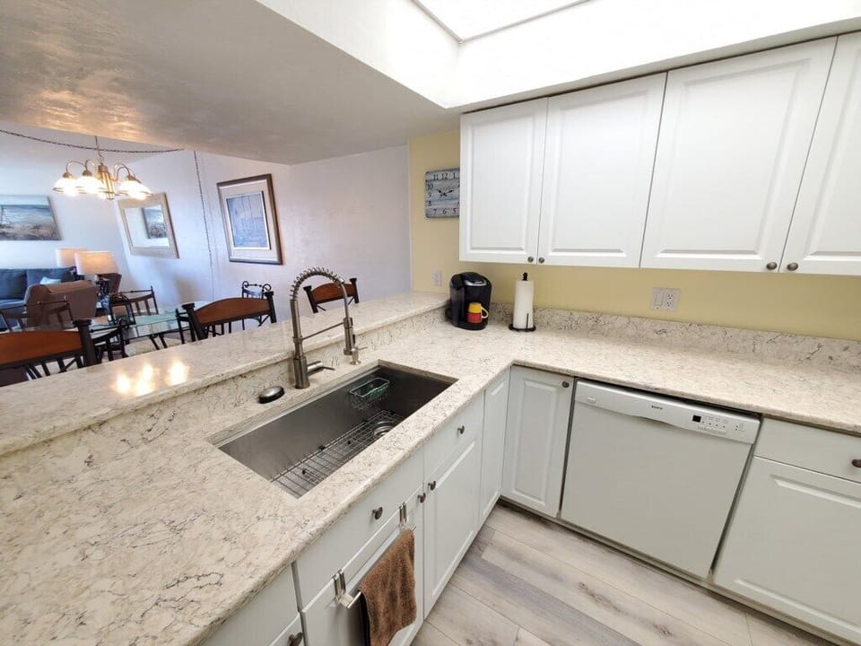 Bright, fully equipped kitchen with a convenient open-plan layout.