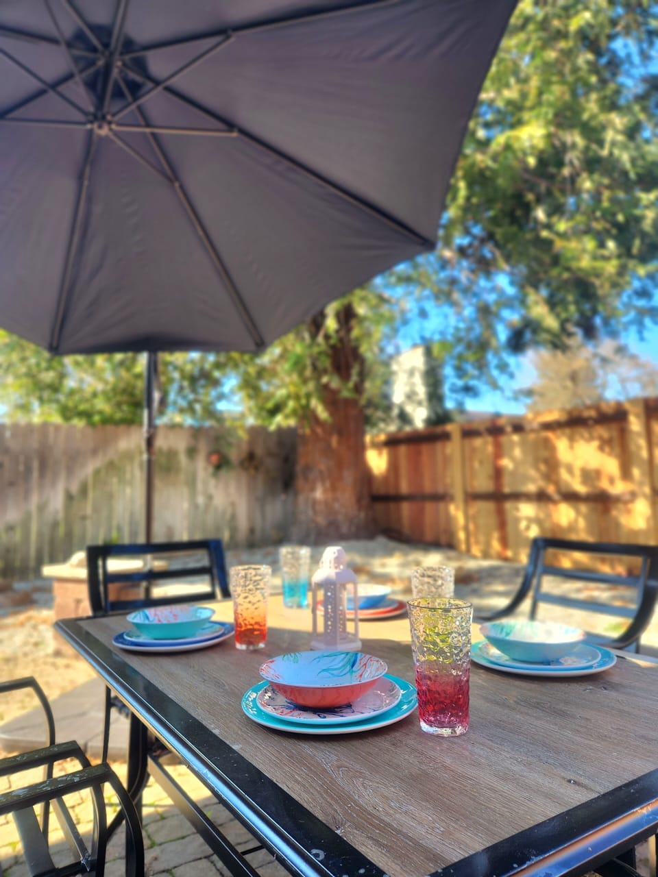 Spacious backyard with furniture, BBQ grill and tools