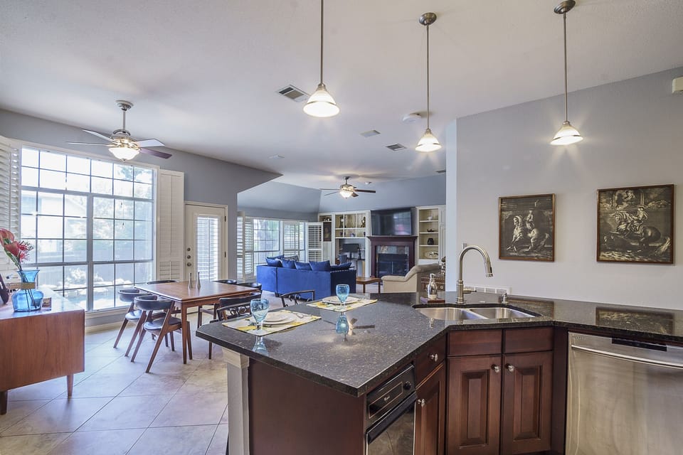 Island kitchen has a bar to allow cooks to socialize