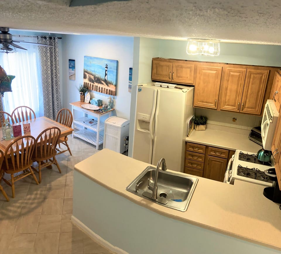 View of Kitchen and Dining area, a table with 6 chairs