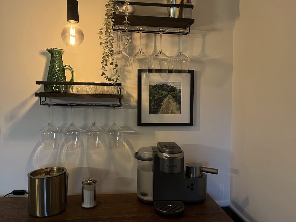 Coffee and Wine Bar.  Keurig makes coffee, espresso and cappuccinos