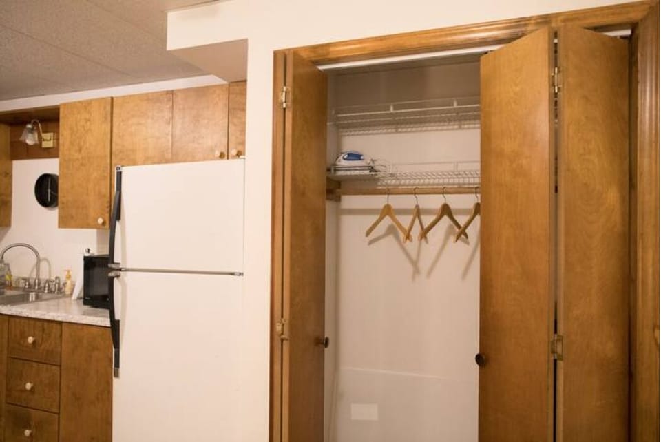 Double closet with two shelves.