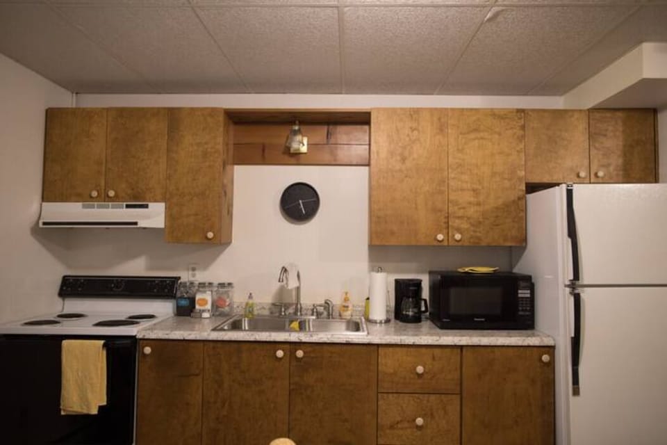 Full sized stove, oven, refrigerator, microwave and coffee maker.