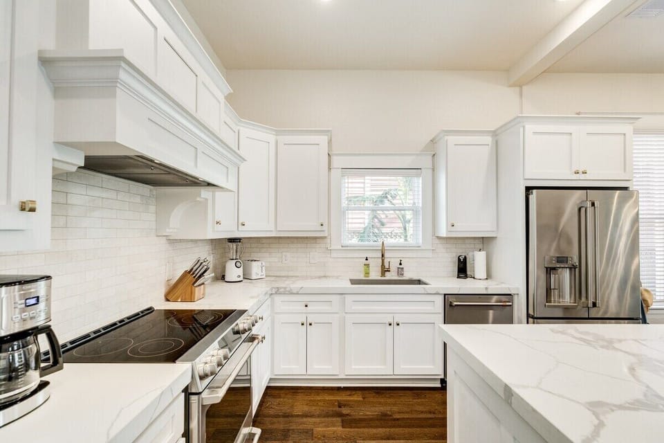 Fully stocked chef's kitchen has gas stove, GE Cafe Refrigerator, quartz countertops, glass cooktop range and convection oven. Keurig and Drip coffee makers and a pantry with all the spices and oils you need to cook a lovely Island meal. 