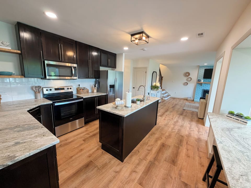 The newly renovated kitchen is equipped with fridge, microwave, stove and oven.