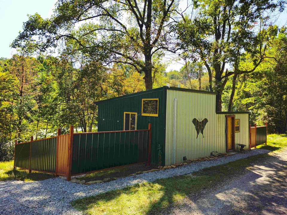 This eclectic custom bungalow, set down a long private driveway, is where you will stay within Raven's Retreat Hocking Hills.