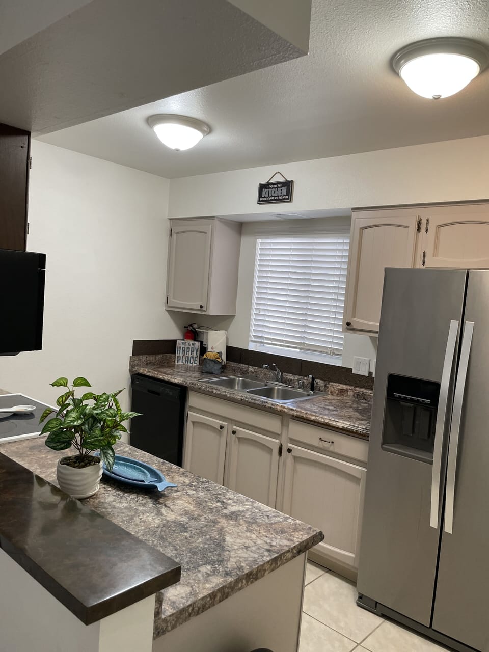 kitchen w/view of the lake. stocked with dishes,cooking pans ,utensils and etc.