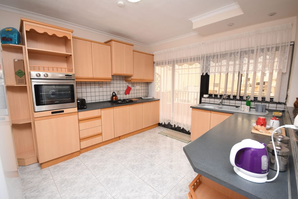 Large kitchen full of amenities