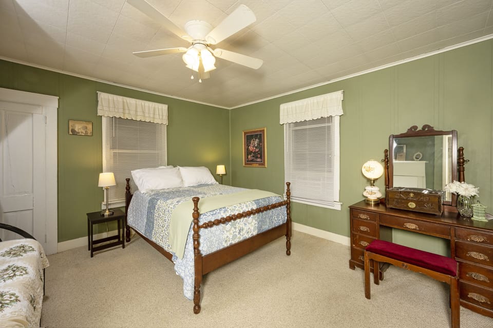 Comfortable full size bed and twin bed in 1887 West Virginia Farm House.