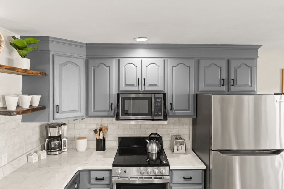 Fully equipped kitchen with brand new stainless steel appliances.