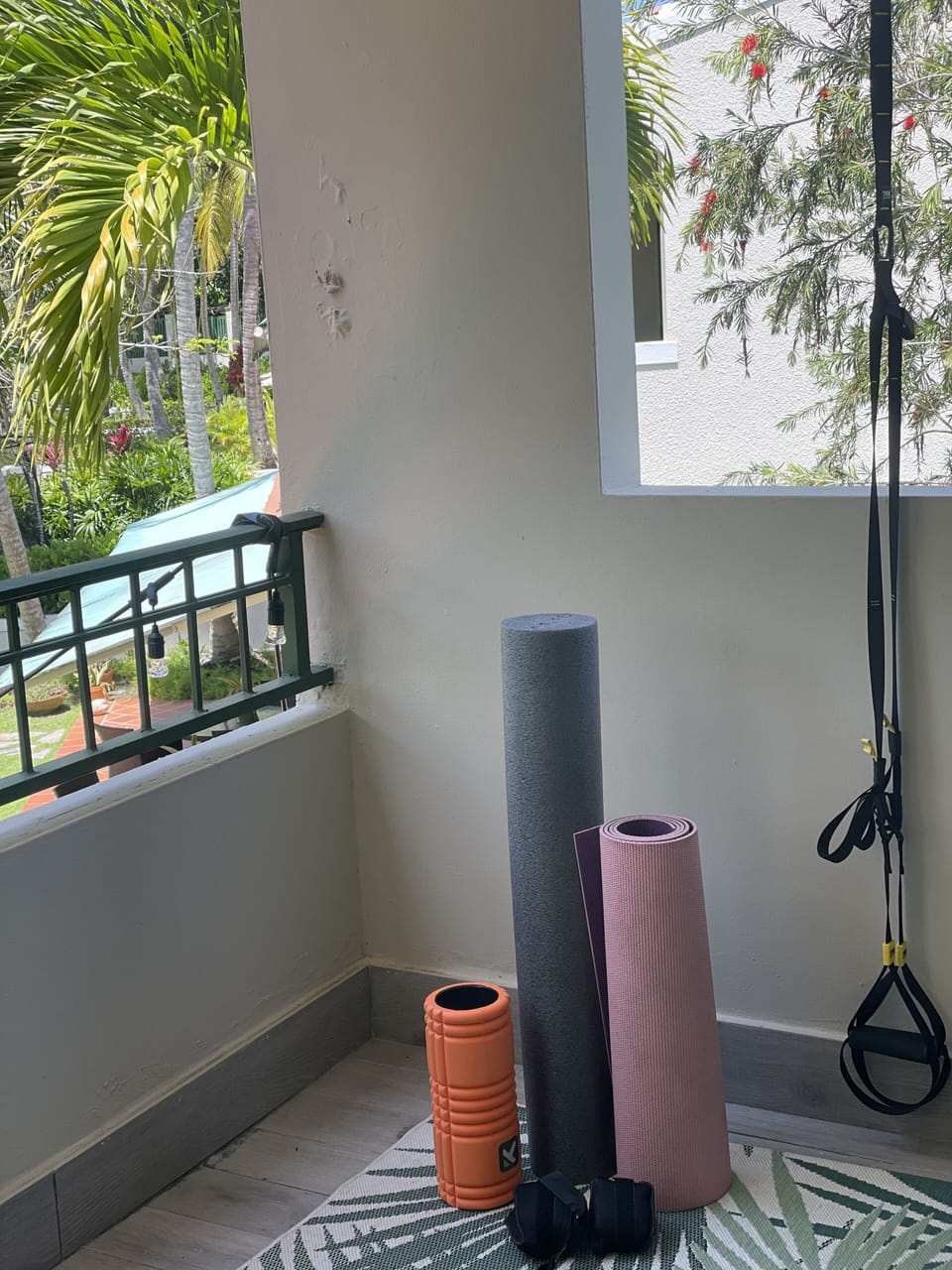 balcony off master bedroom with exercise equipment 
