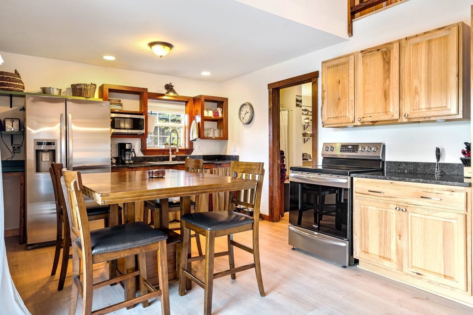 Fully equipped kitchen with drip coffee maker and large fridge