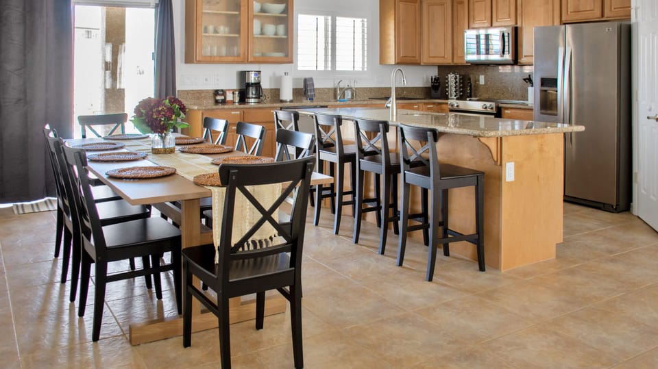 The gorgeous dining table seats 8 people.  4 more can sit on the island. 