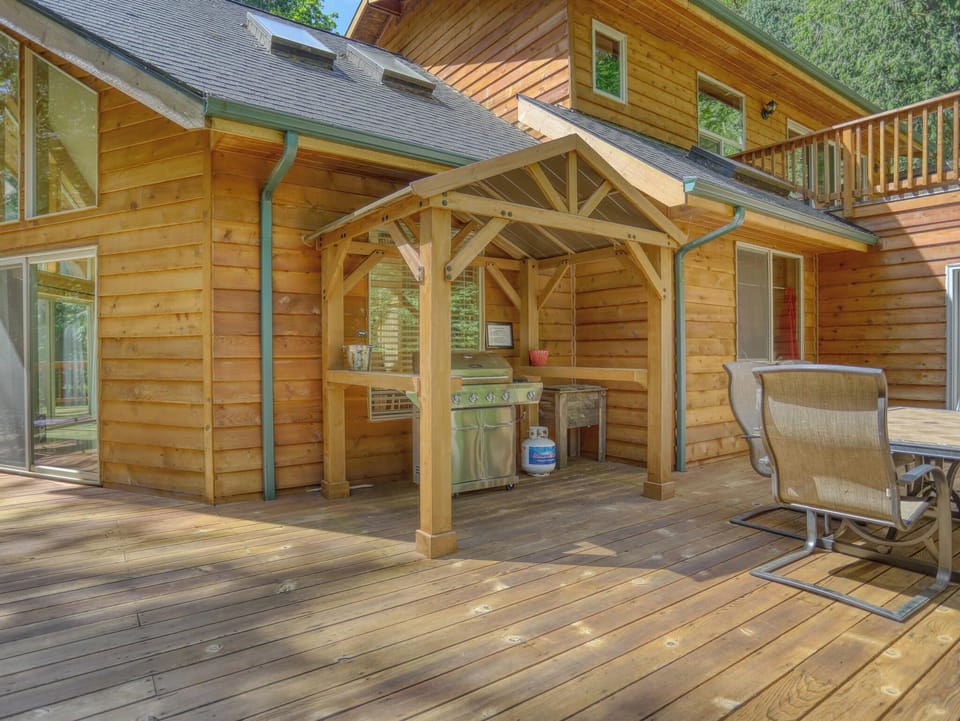 Your private outdoor cooking pavilion awaits, complete with a covered grill station and plenty of deck space for outdoor dining surrounded by nature.