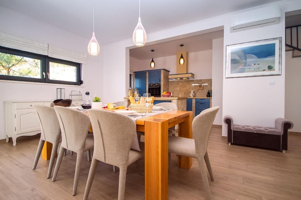 Kitchen area. Fully equipped kitchen and dining area with exit to outdoor furniture