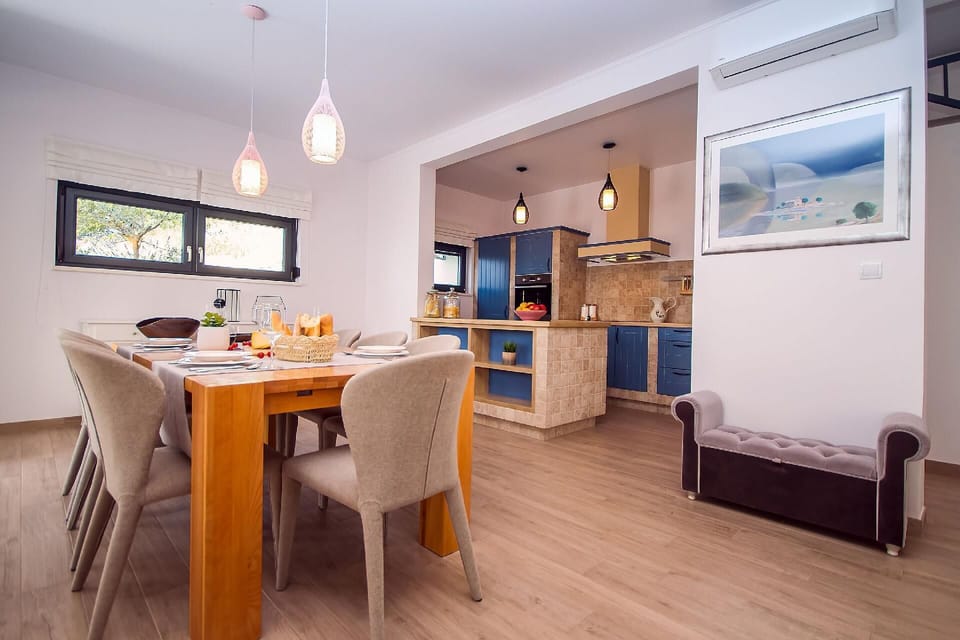 Kitchen area. Fully equipped kitchen and dining area with exit to outdoor furniture