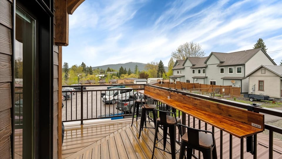 Wrap around balcony includes laptop workspace and views of Big Mountain, Weber grill with propane provided, comfy outdoor sectional to enjoy a wonderful view of the sunset.