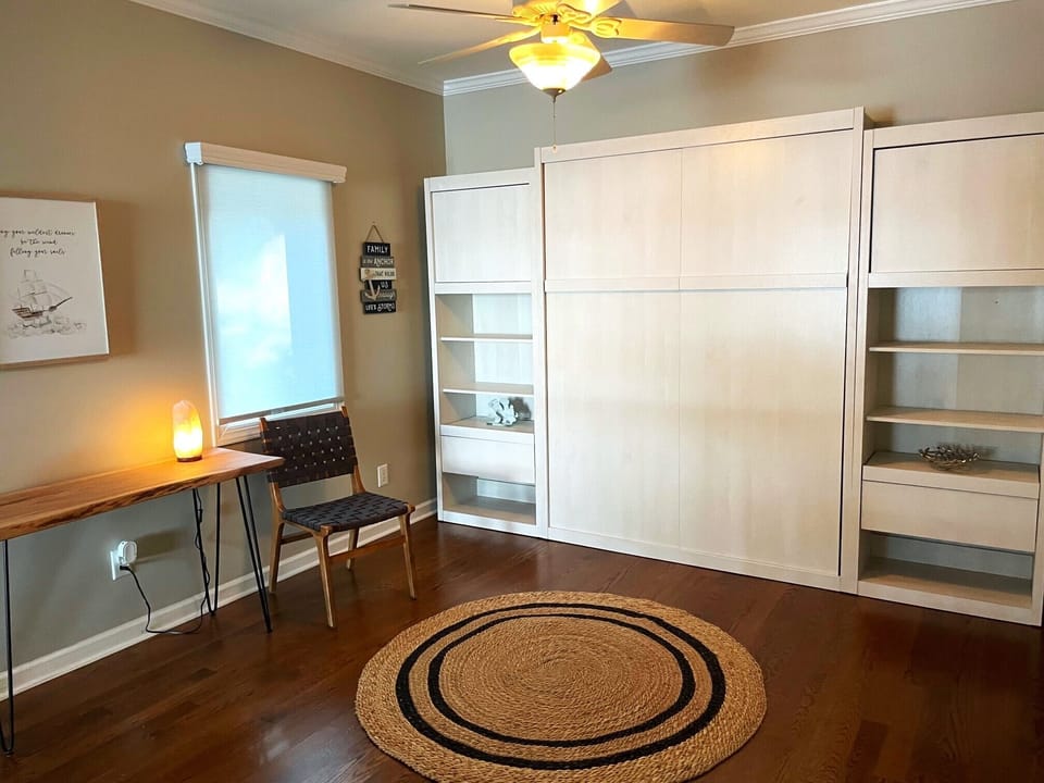Loft area with queen murphy bed and work space