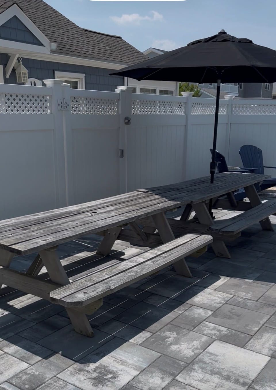 Backyard with 2 picnic tables for plenty of seating