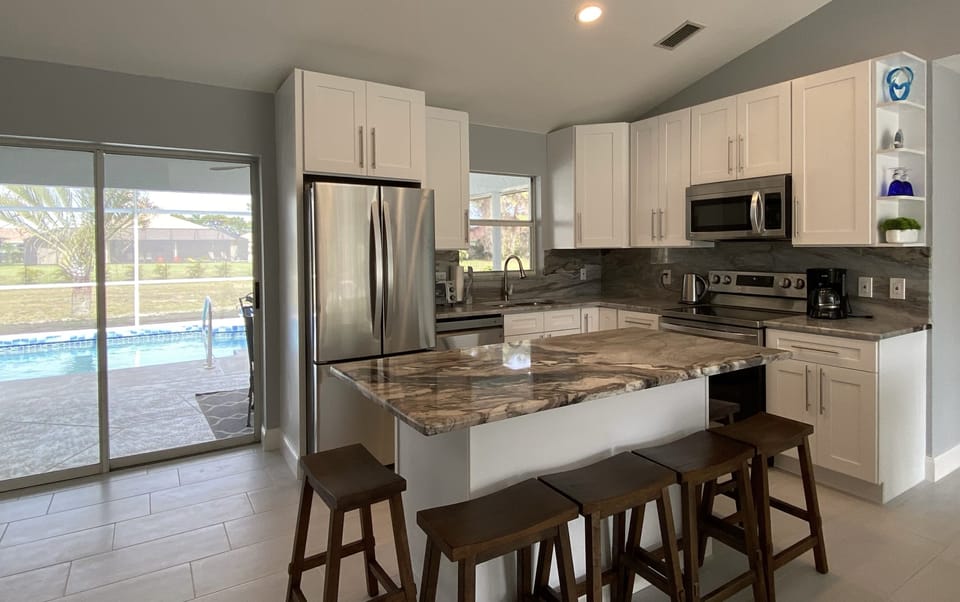 Kitchen with sliding door access to the pool and lanai