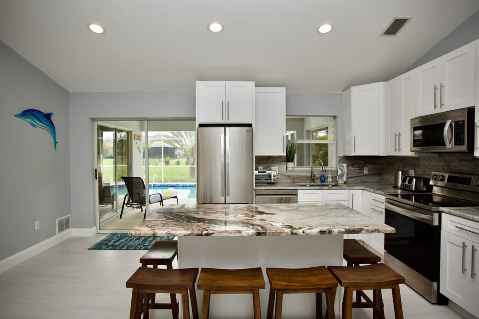 This elegant kitchen is fully equipped with stainless steel appliances.