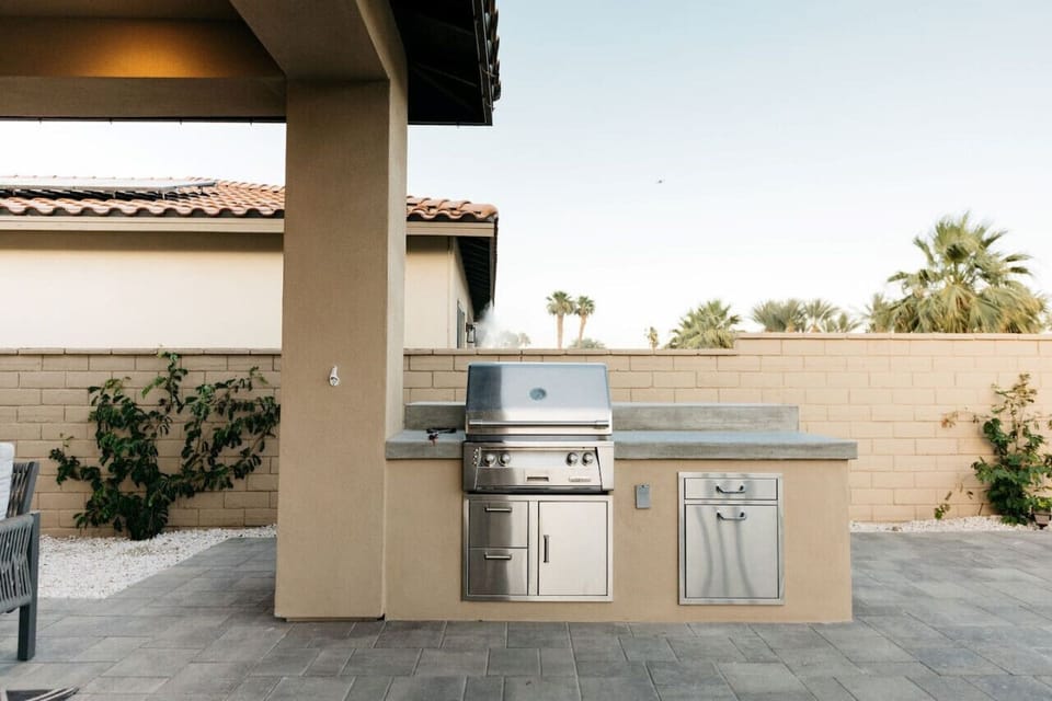Built-in BBQ station w/ counter space, ready for easy outdoor cooking