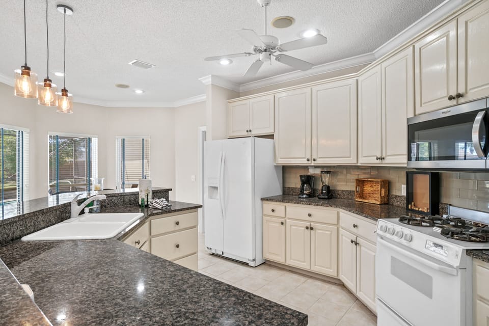 Large, open kitchen. Great for making memories and cooking family meals after a day at the beach or lounging around the pool.