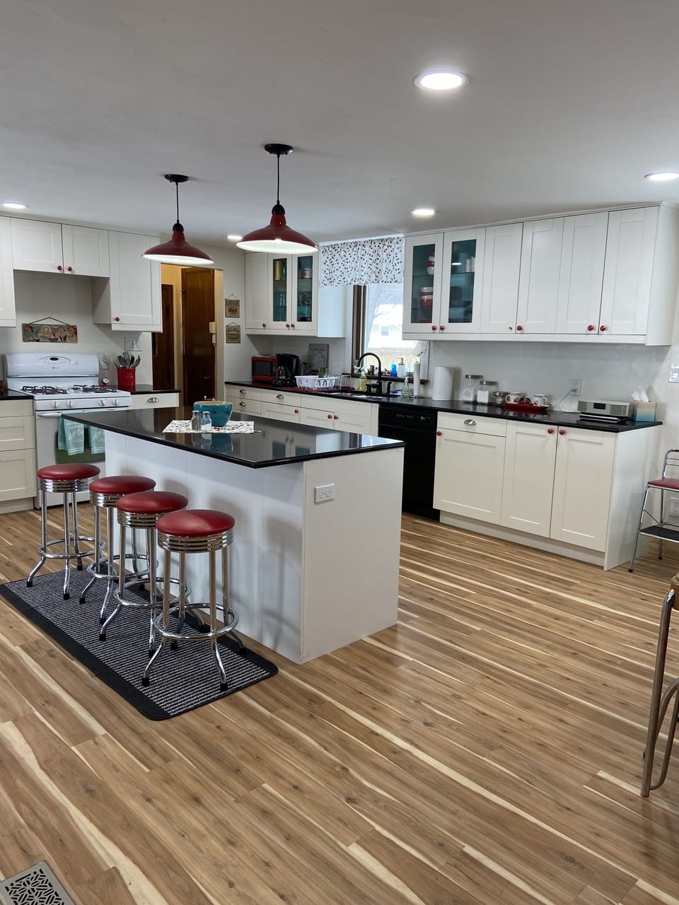 Open concept kitchen with big island complete with swivel diner stools!