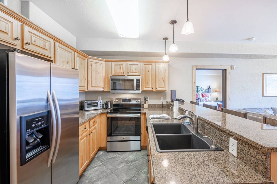 The updated, fully stocked kitchen features stainless steel appliances, French door fridge and plenty of granite countertops!
