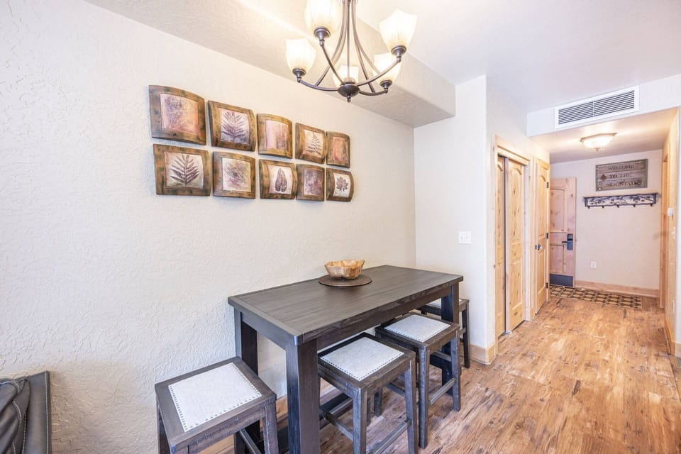 In addition to the breakfast bar, guests can enjoy meals together at the modern dining table