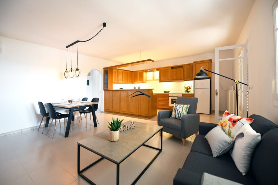 The living room, dining area and fully equipped kitchen