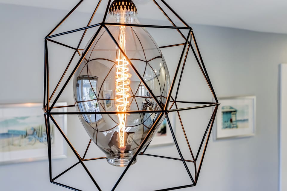 Farmhouse-style lighting illuminates the open space