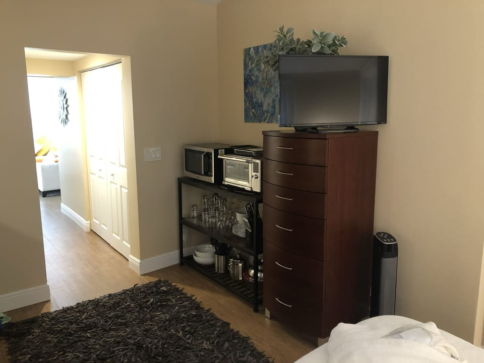 Tall chest of drawers for storage and the bedroom Smart TV  