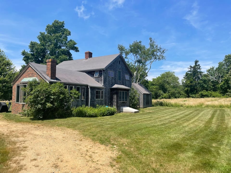 Additional side yard, Grange Hall is next door via path at end of lawn.