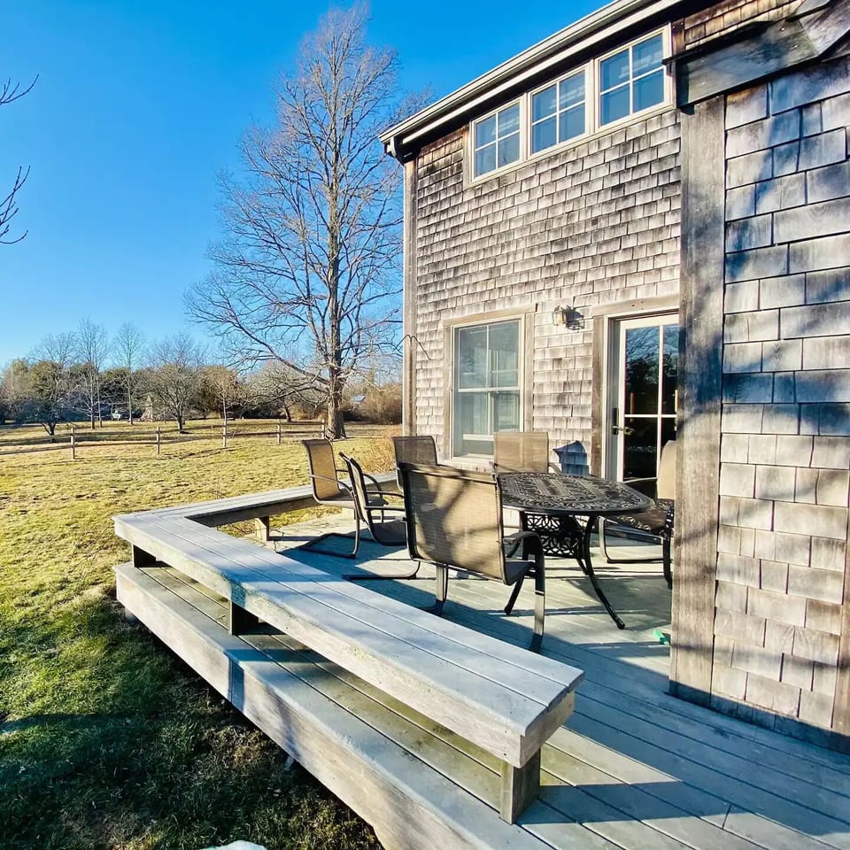 Front deck for relaxing and dining. Gas grill included with property.