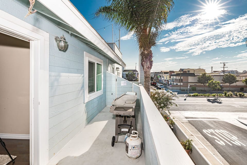 Your private balcony overlooks the boulevard and includes a propane gas grill and a small seating area.
                
