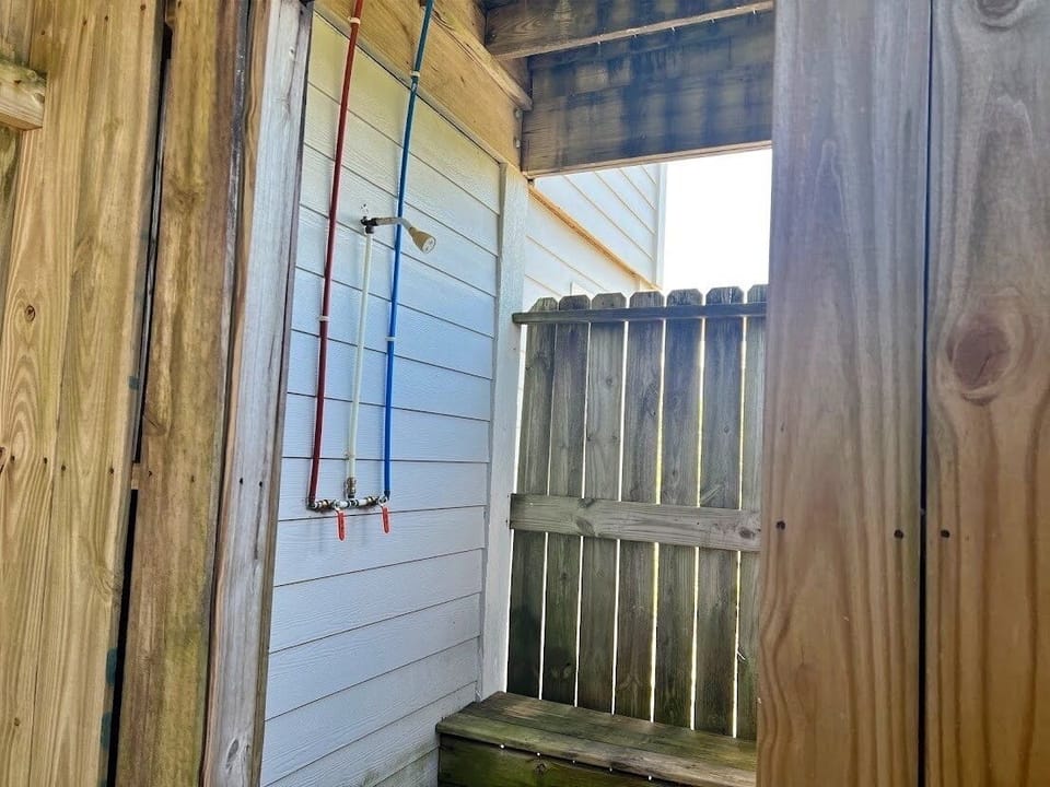 Hot and cold water outdoor shower
