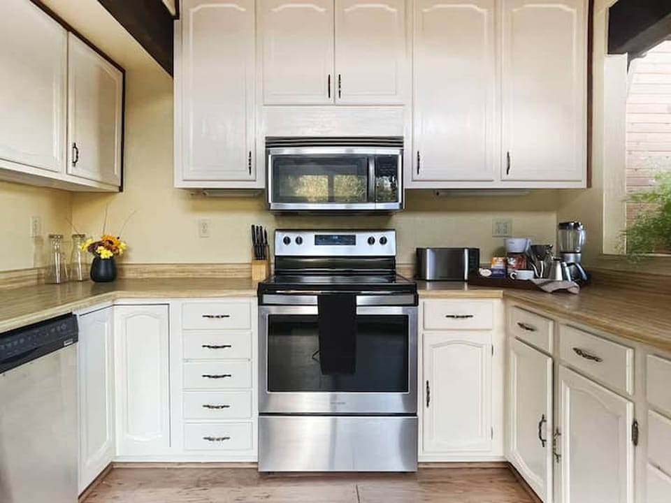 Fully equipped kitchen for basic cooking and dining needs.
