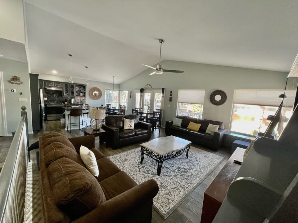 spacious living room with window view to front balcony.