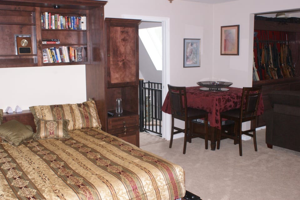 Central table positioned to provide room for the Murphy bed to be deployed.