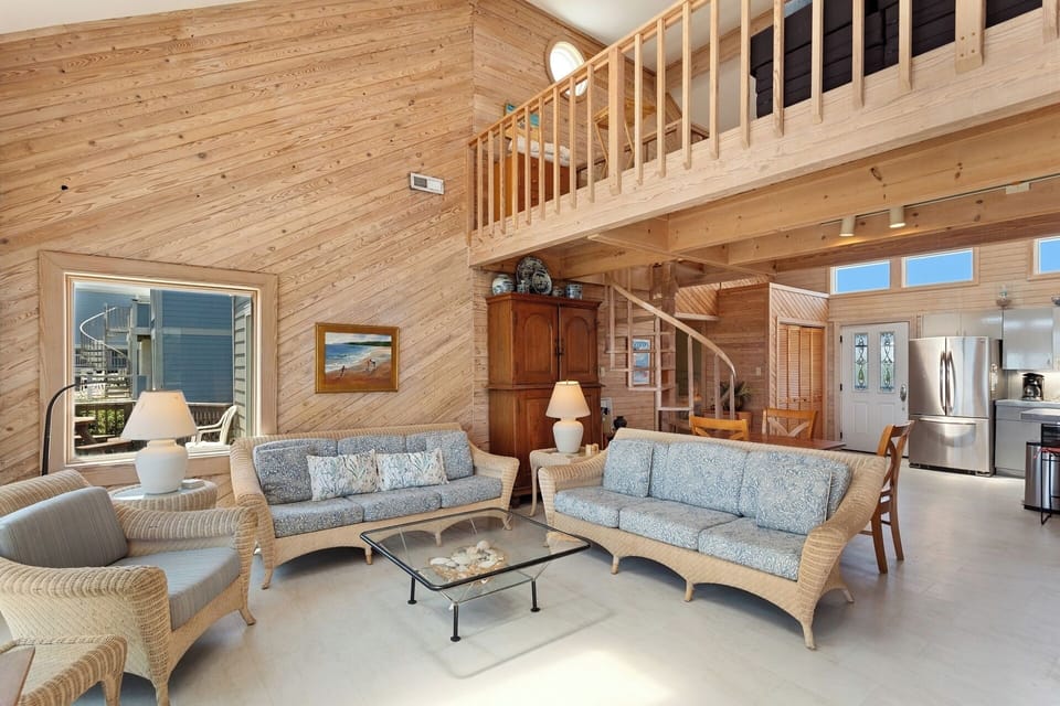 Bask in the unlimited natural light of the open Living Area with high ceilings and cozy furniture.