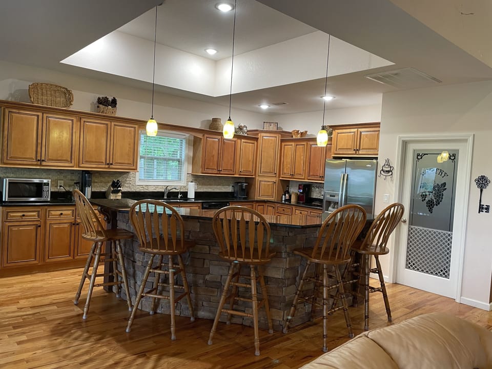 Additional raised bar seating for eating or visiting while cooking. 