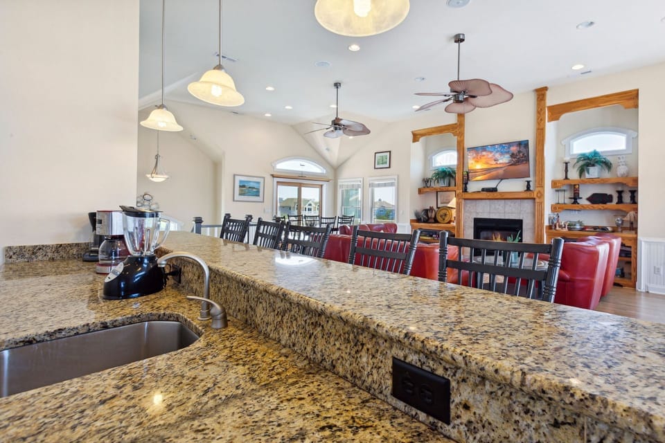 Whip up a delicious meal in the Modern Kitchen with stainless steel appliances, 2 Refrigerators, 2 Dishwashers, 2 Microwave Ovens, a Range, and a Wine Cooler. (Note: fireplace not for guest use)