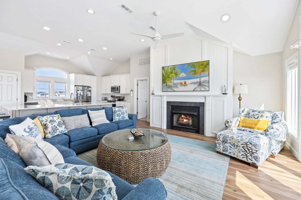 Relax on the Top Level with lots of natural light and brilliant views of the Atlantic Ocean. (New 75" TV & Redesigned Fireplace!)