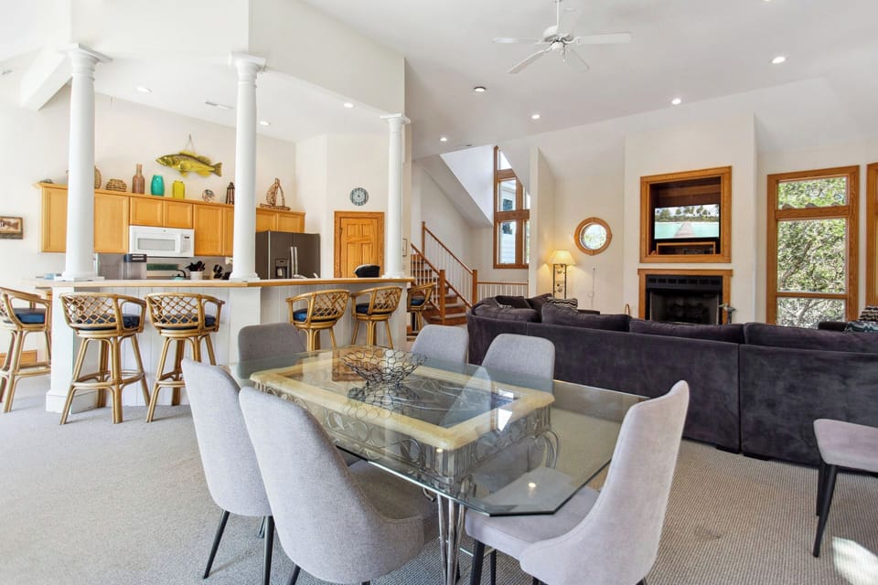 Relax in the spacious Living Area with high ceilings and lots of natural light. (Please note: Fireplace is not for guests use)
