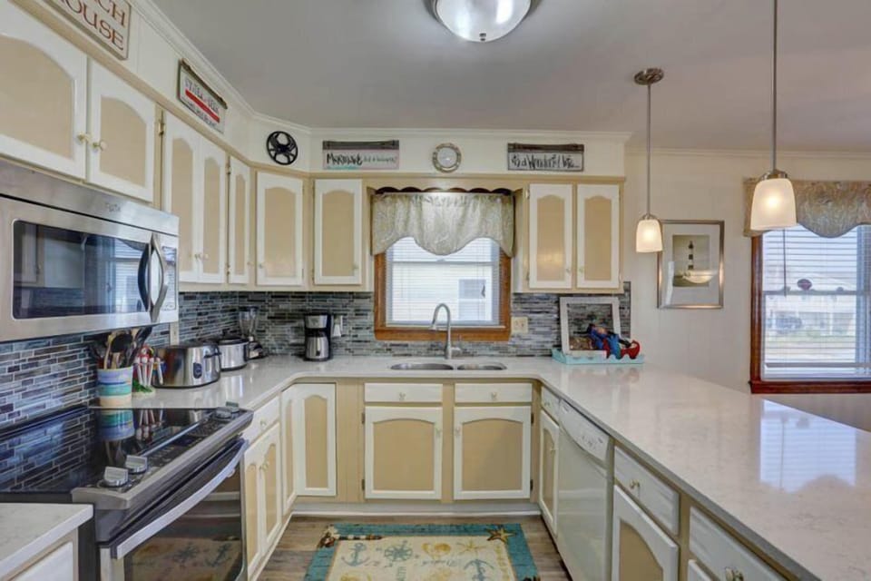 Test your skills in the upgraded Kitchen complete with quartz countertops, stainless steel stove, and microwave.