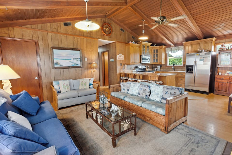 Enjoy cozy wooden paneling and a Flat Screen TV in the Living Area.