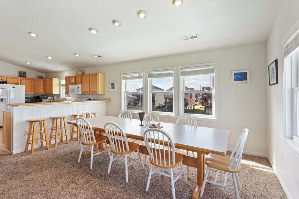 The Dining Area and additional Counter Bar seating are an ideal spot for enjoying a meal together.