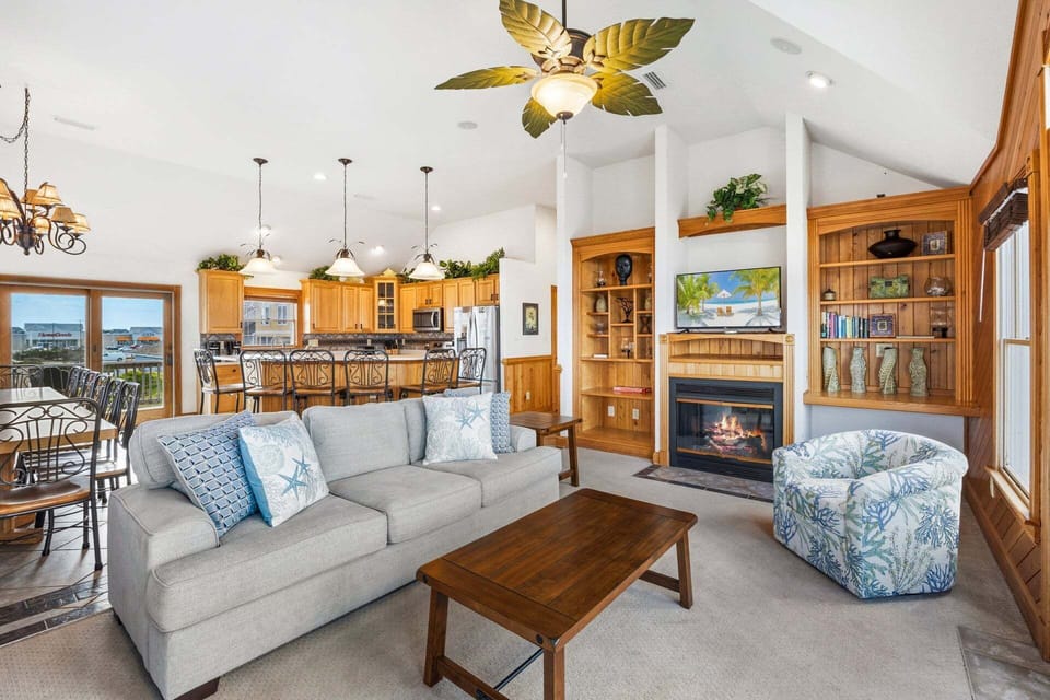 Enjoy perfect serenity with style and comfort in the expansive Top-Level Living Area with high ceilings and a Flat Screen TV.